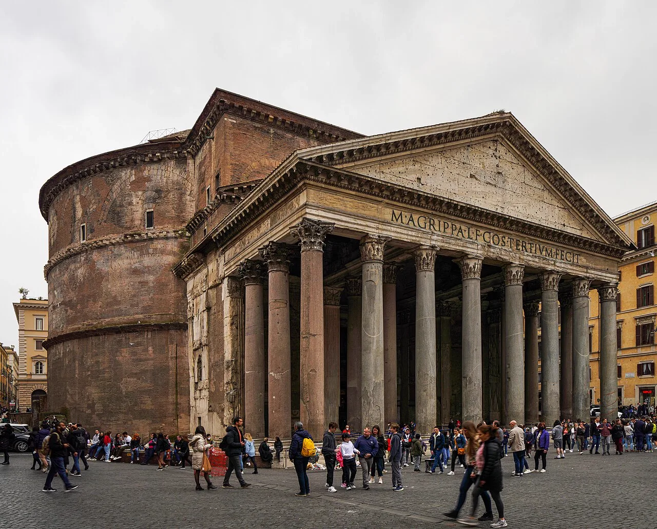 People walking across the square in front of the Pantheon in Rome